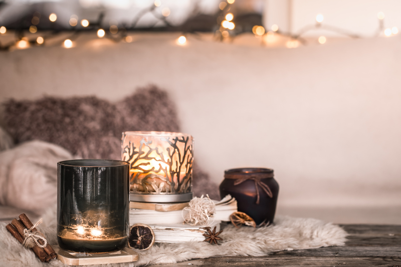 Reuse Candle Jar: A Cozy Candle Setup Featuring Decorative Glass Jars Styled With Warm Lighting, Soft Textures, And Dried Botanicals—Ideal For Showcasing Creative Ways To Reuse Candle Jars At Home.