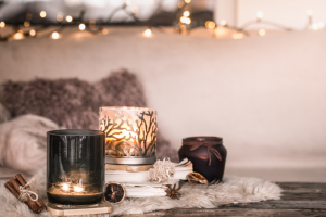 Reuse Candle Jar: A Cozy Candle Setup Featuring Decorative Glass Jars Styled With Warm Lighting, Soft Textures, And Dried Botanicals—Ideal For Showcasing Creative Ways To Reuse Candle Jars At Home.